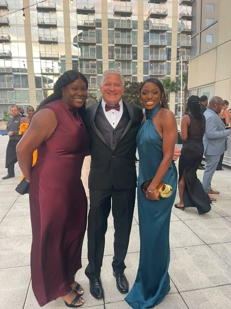 Sonia Collier, Marvin Arrington and Melissa Jefferson-Wooden on the rooftop terrace at the gala